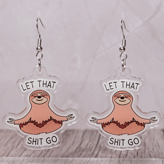 Cute sloth dangle earrings in meditation pose with text “let that shit go”