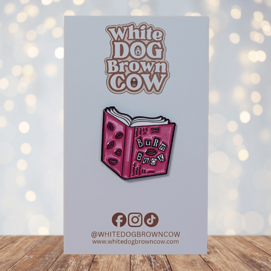Funny pink “Burn Book” style enamel pin with lips and book design