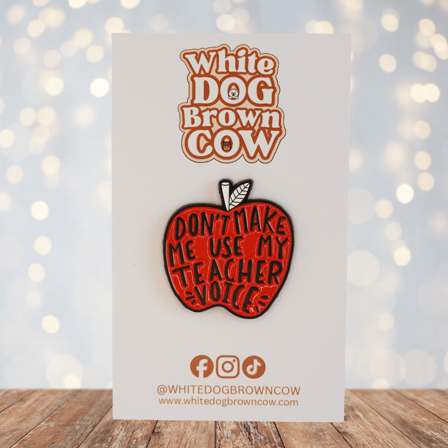 Red apple enamel pin with text โdonโt make me use my teacher voice,โ funny teacher gift pin