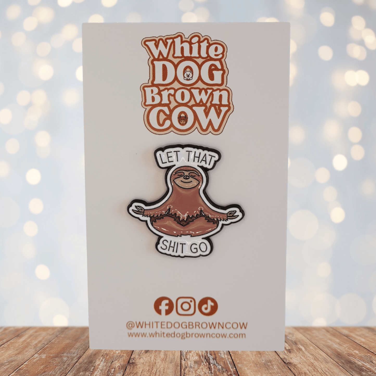 Funny sloth enamel pin meditating with text “let that shit go,” sarcastic stress relief novelty pin