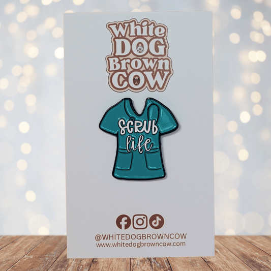 Funny “Scrub Life” enamel pin shaped like teal medical scrubs for nurses and healthcare workers