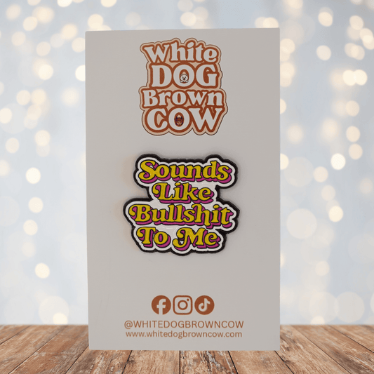 Colorful retro style enamel pin that says sounds like bullshit to me in bold lettering