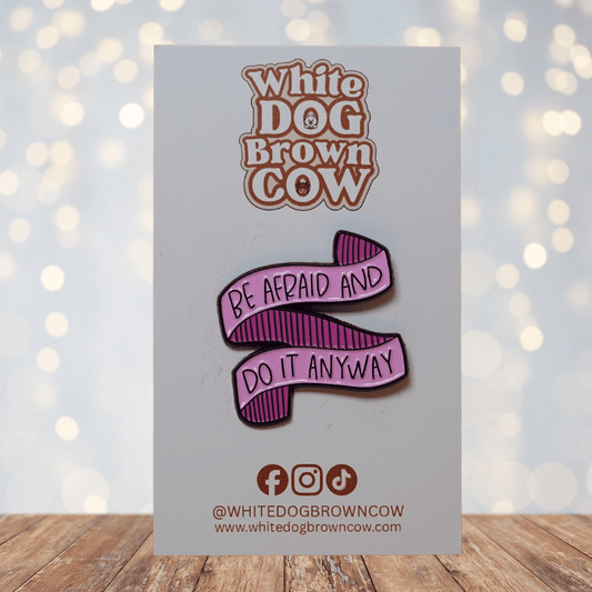 Ribbon enamel pin with the quote “Be Afraid and Do It Anyway,” motivational banner lapel pin.