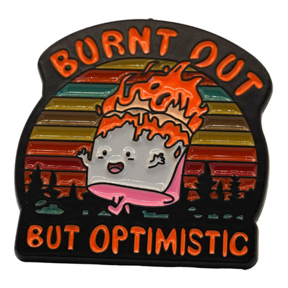 "Burnt Out But Optimistic" Enamel Pin
