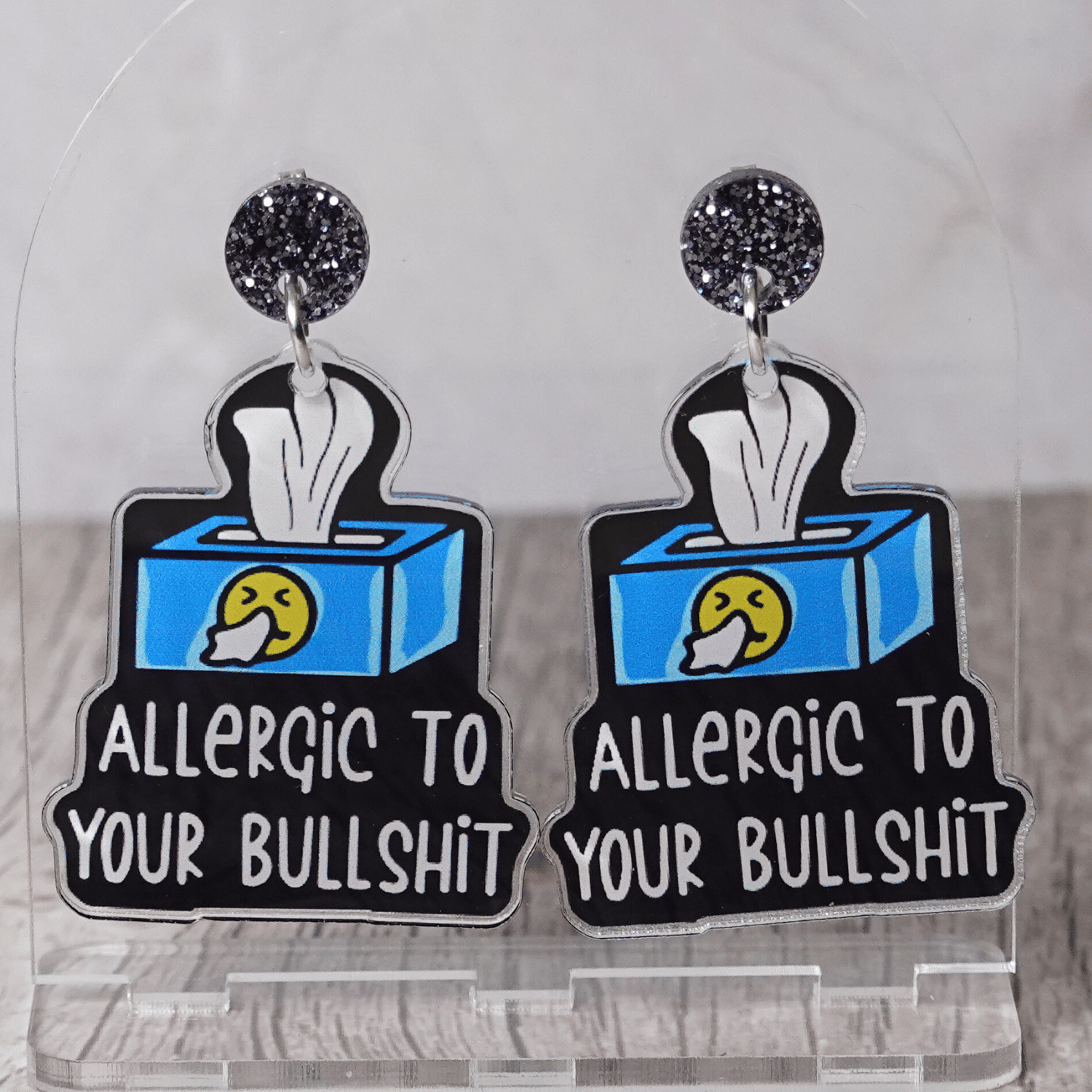 Acrylic dangle earrings shaped like a tissue box with text reading “Allergic to your bullshit”