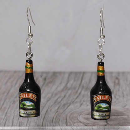 Mini Irish cream liqueur bottle shaped dangle earrings with dark bottle design and silver hooks.
