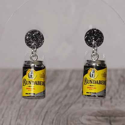 Novelty dangle earrings shaped like small rum and cola drink cans