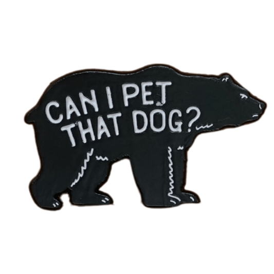 Black bear-shaped enamel pin with the phrase “Can I pet that dog?” written in white text across the body.
