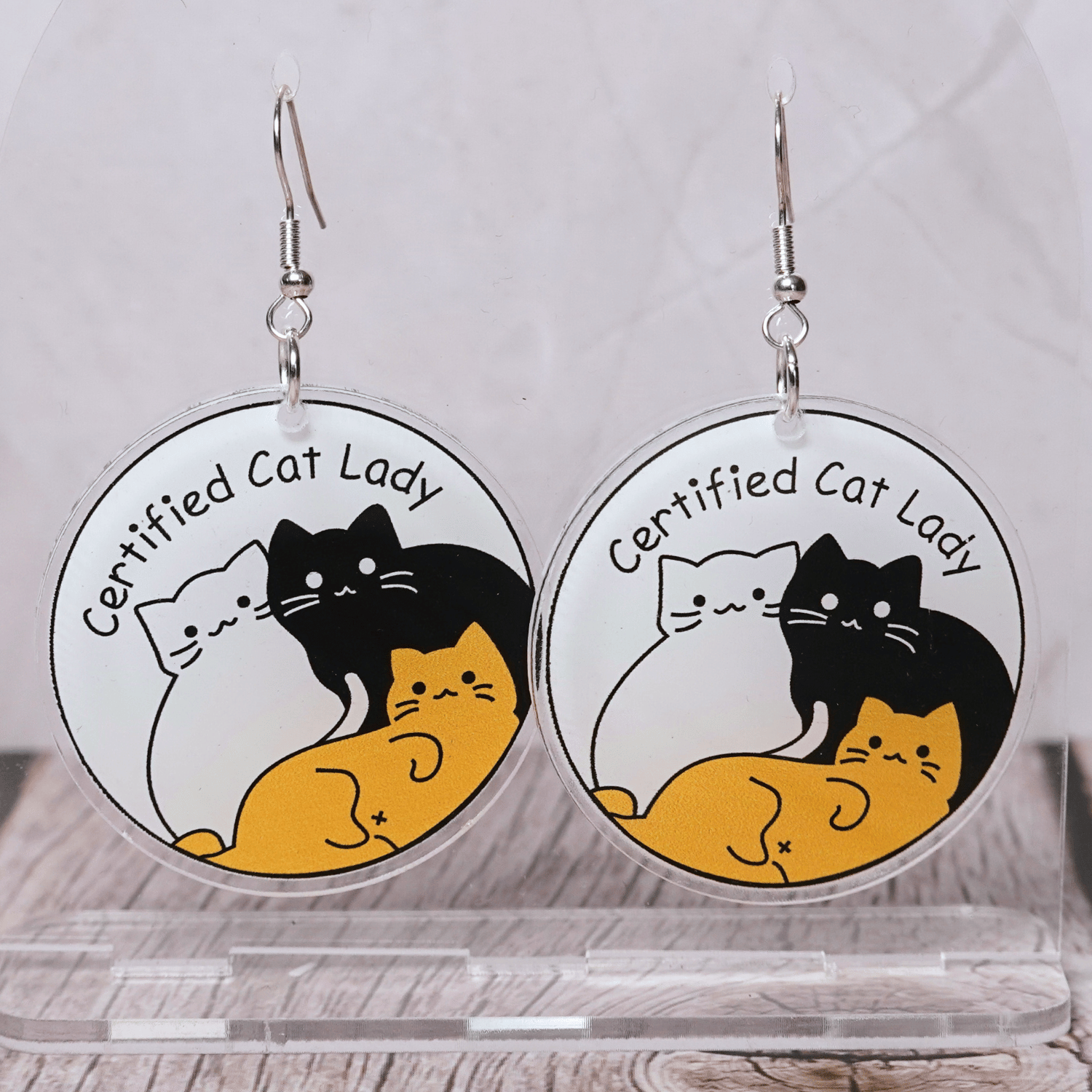 Round dangle earrings with cute cats and text “Certified Cat Lady”