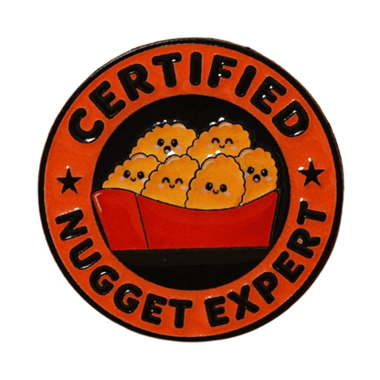 Funny Certified Nugget Expert enamel pin with cute smiling chicken nuggets in a red box, foodie lapel pin gift for nugget lovers.