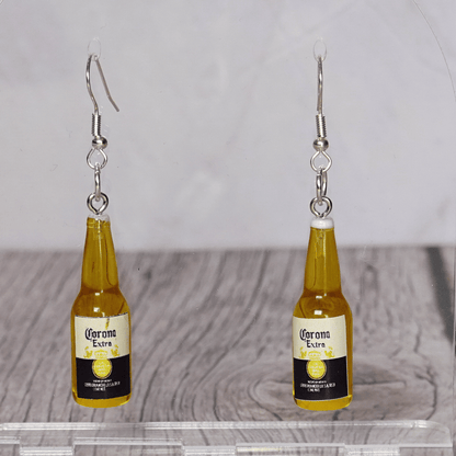 Novelty dangle earrings shaped like small beer bottles