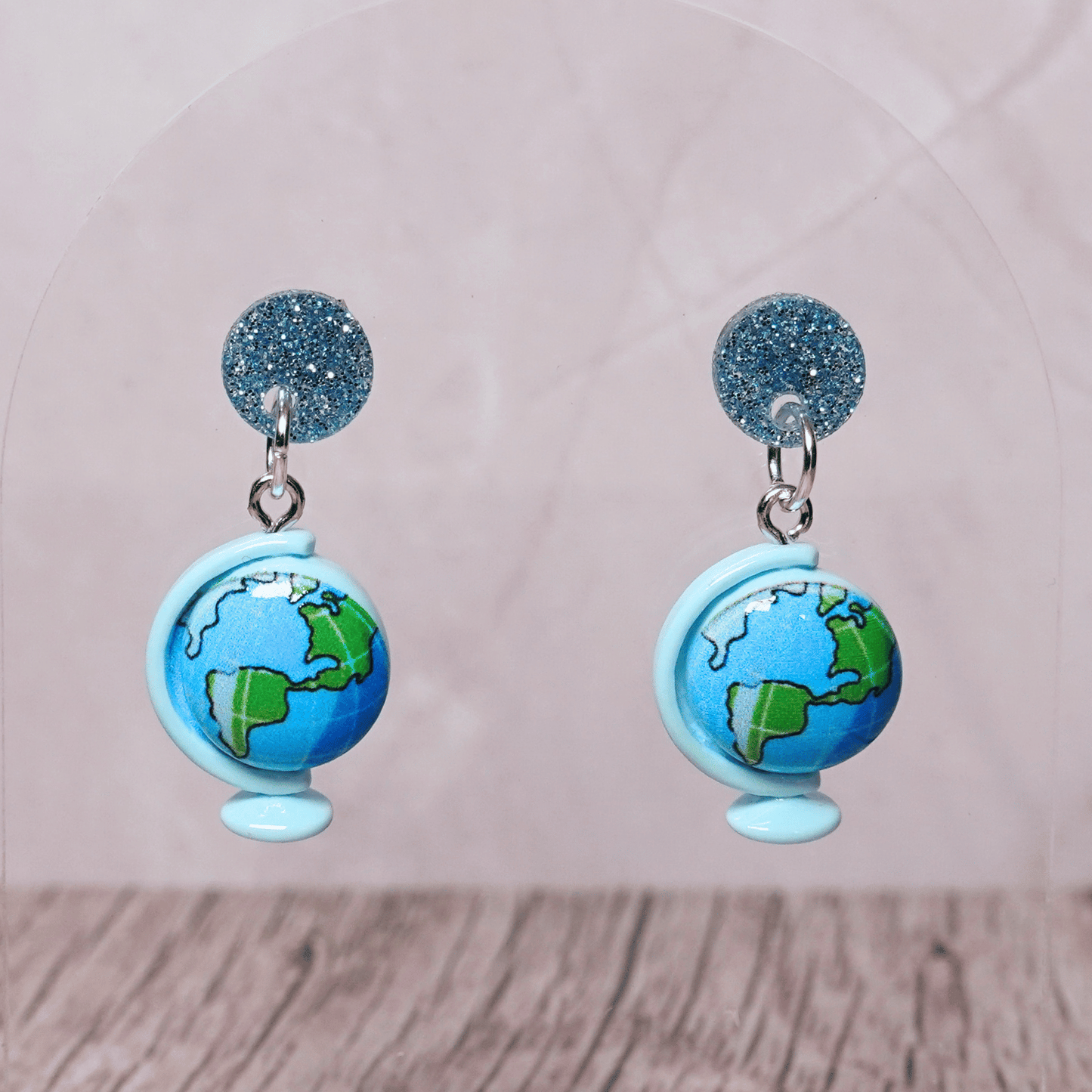 Blue globe dangle earrings with world map design and glitter stud tops