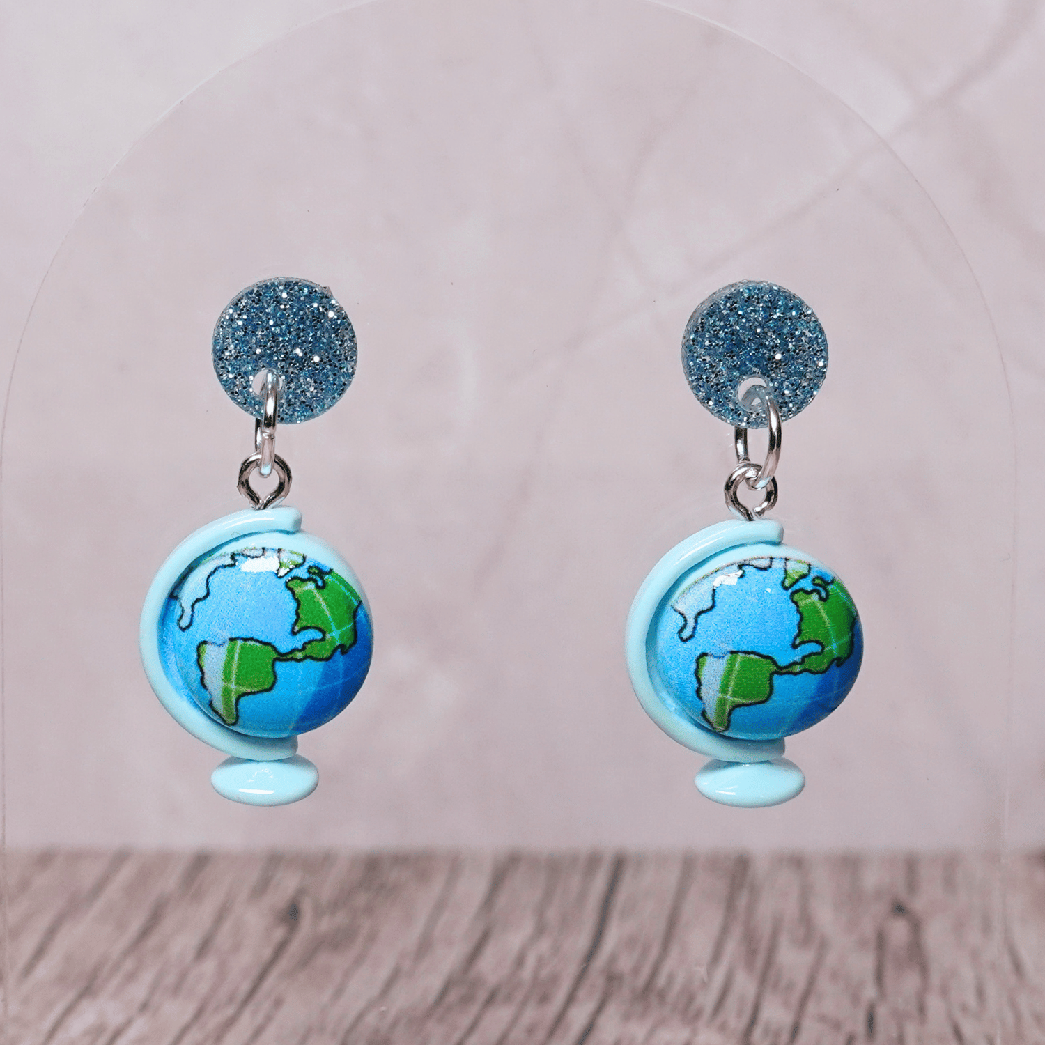 Blue globe dangle earrings with world map design and glitter stud tops