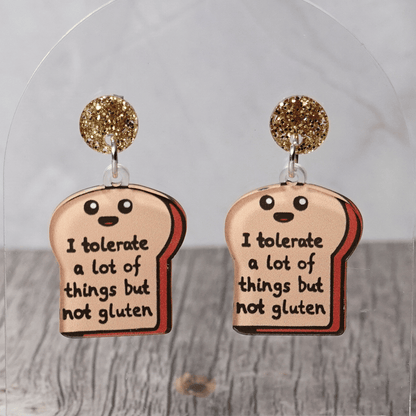Acrylic dangle earrings shaped like a slice of bread with text reading “I tolerate a lot of things but not gluten”