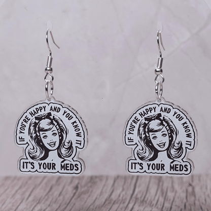 Black and white retro style earrings with woman illustration and text “If you’re happy and you know it it’s your meds”