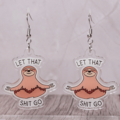 Cute sloth dangle earrings in meditation pose with text “let that shit go”