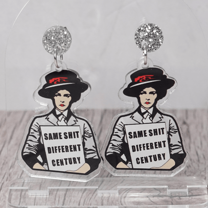Funny acrylic dangle earrings featuring a vintage-style woman holding a sign that reads “Same shit different century.”