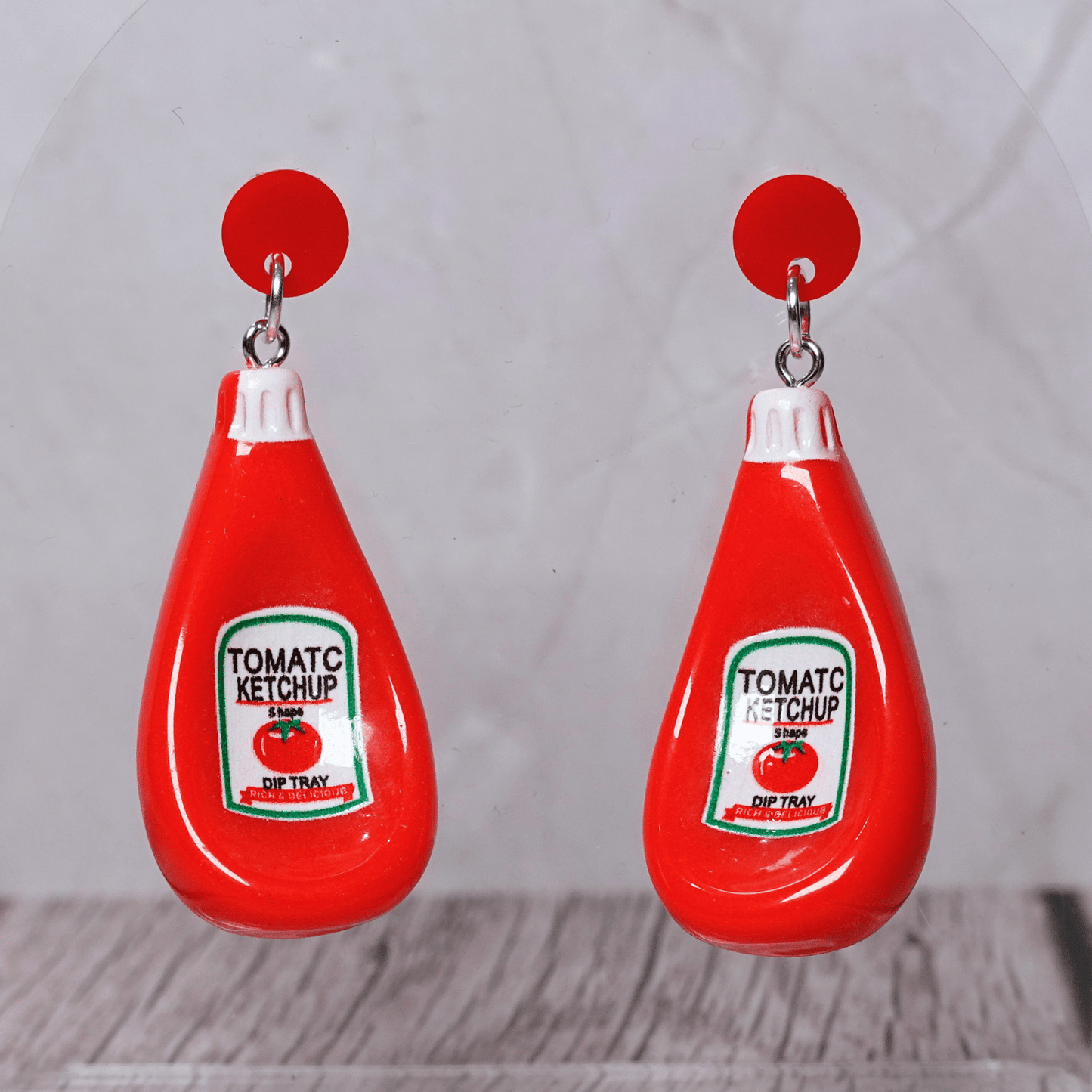Red tomato ketchup bottle shaped dangle earrings with white cap and red stud tops