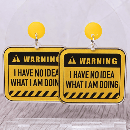 Yellow caution sign style dangle earrings with text “I have no idea what I’m doing”