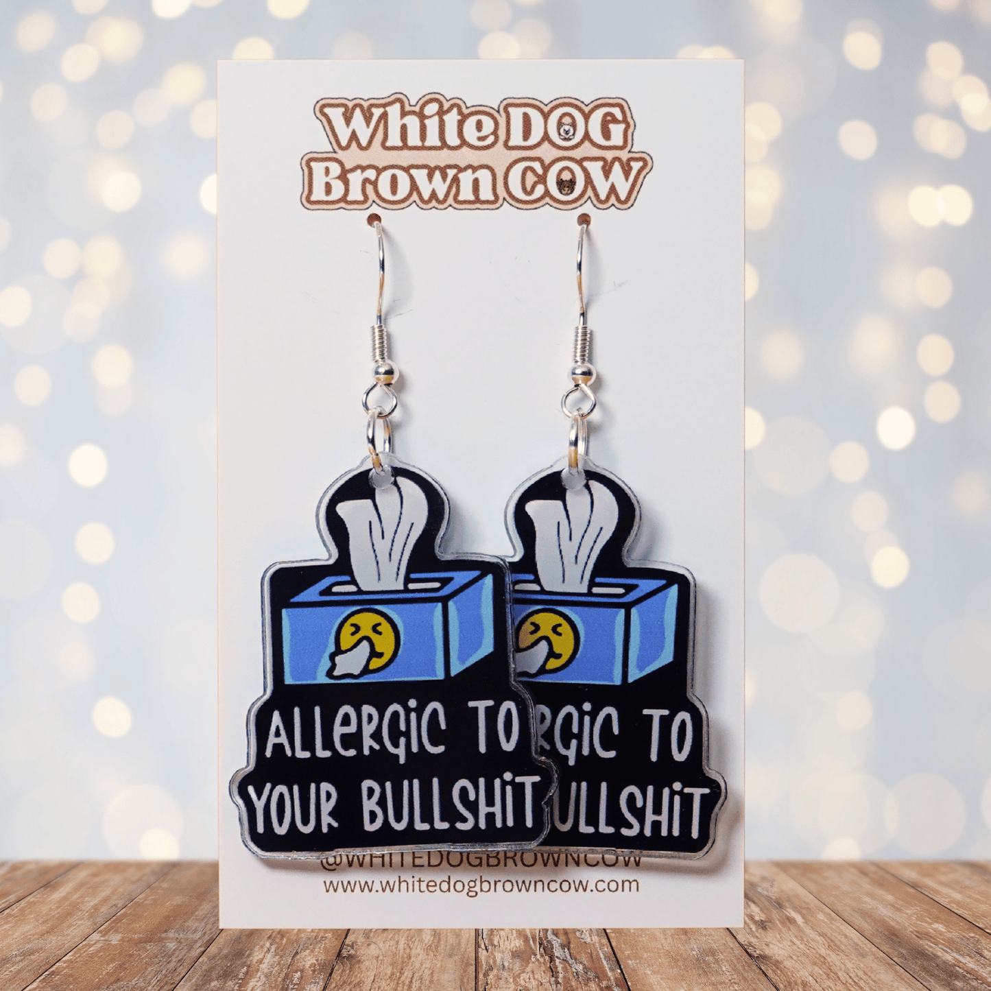 Acrylic dangle earrings shaped like a tissue box with text reading “Allergic to your bullshit”