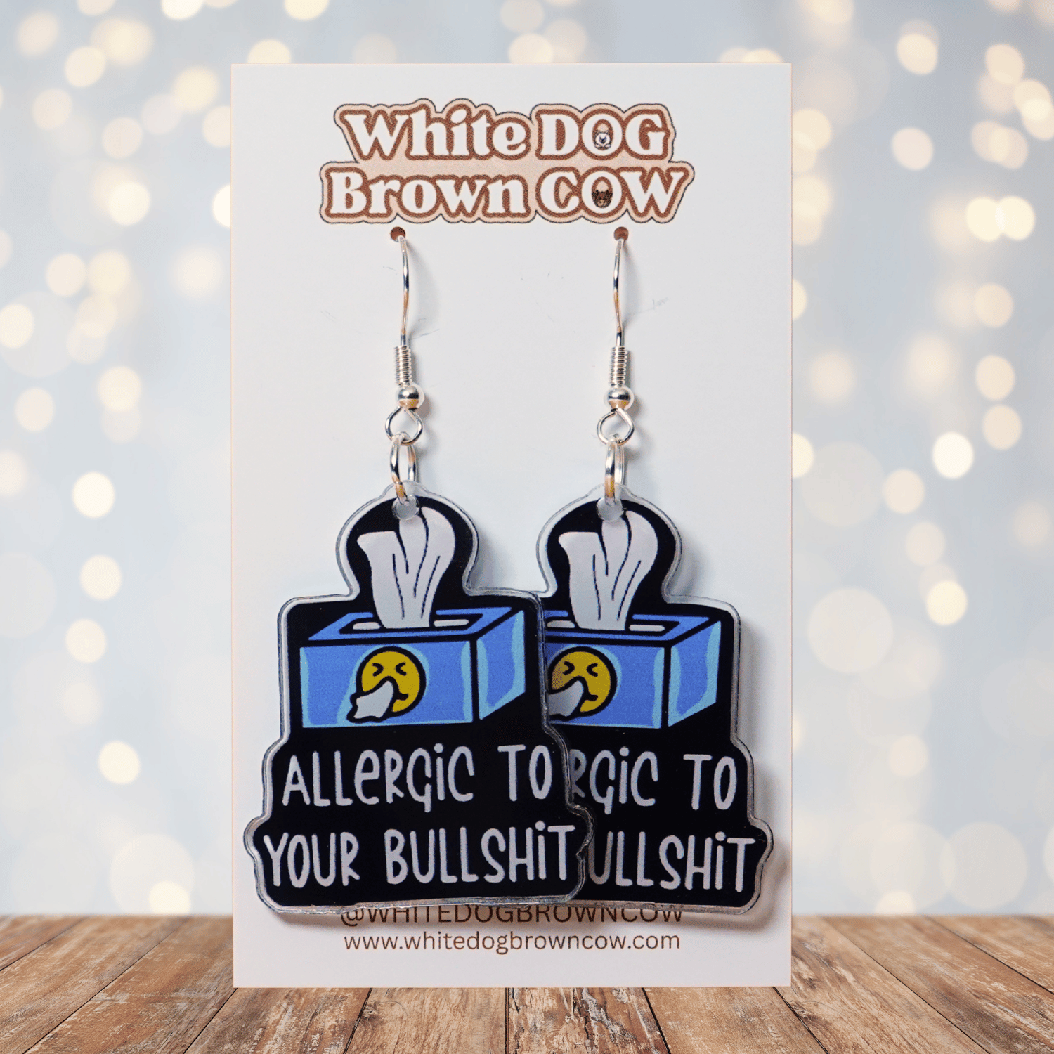 Acrylic dangle earrings shaped like a tissue box with text reading “Allergic to your bullshit”