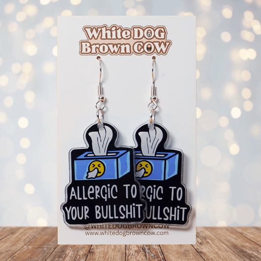 Acrylic dangle earrings shaped like a tissue box with text reading “Allergic to your bullshit”