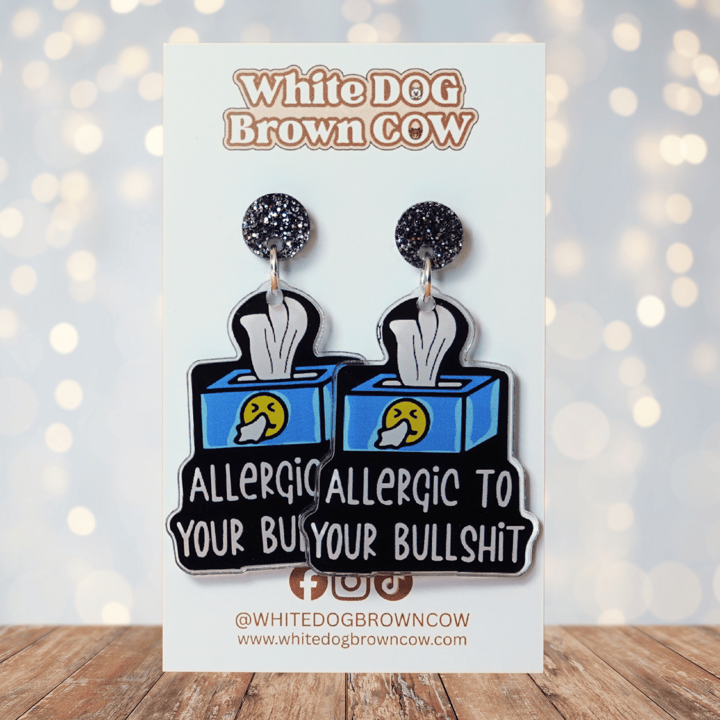 Acrylic dangle earrings shaped like a tissue box with text reading “Allergic to your bullshit”