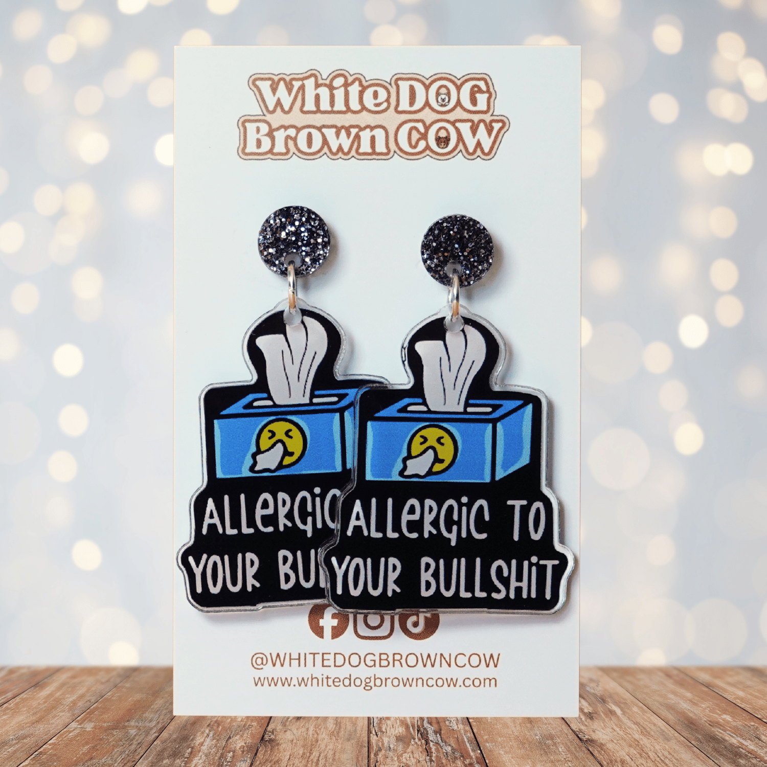 Acrylic dangle earrings shaped like a tissue box with text reading “Allergic to your bullshit”