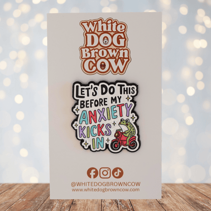 Funny colorful enamel pin with frog on scooter saying “let’s do this before my anxiety kicks in,” humorous mental health novelty pin