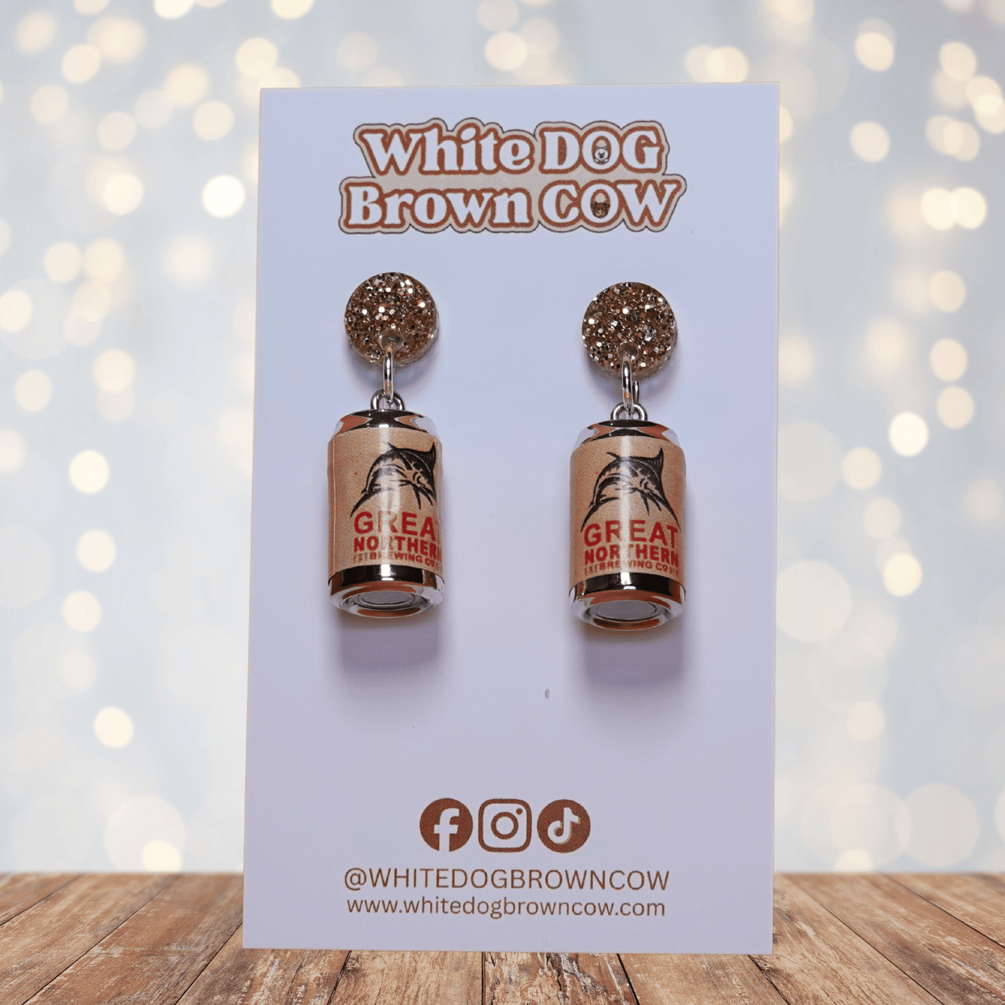 Mini beer can shaped dangle earrings with tan label design and glitter stud tops
