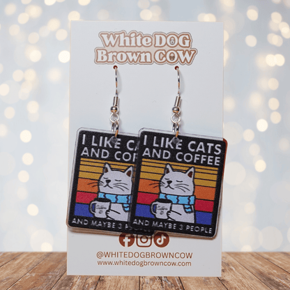Square dangle earrings with cat holding coffee mug and text “I like cats and coffee and maybe 3 people”