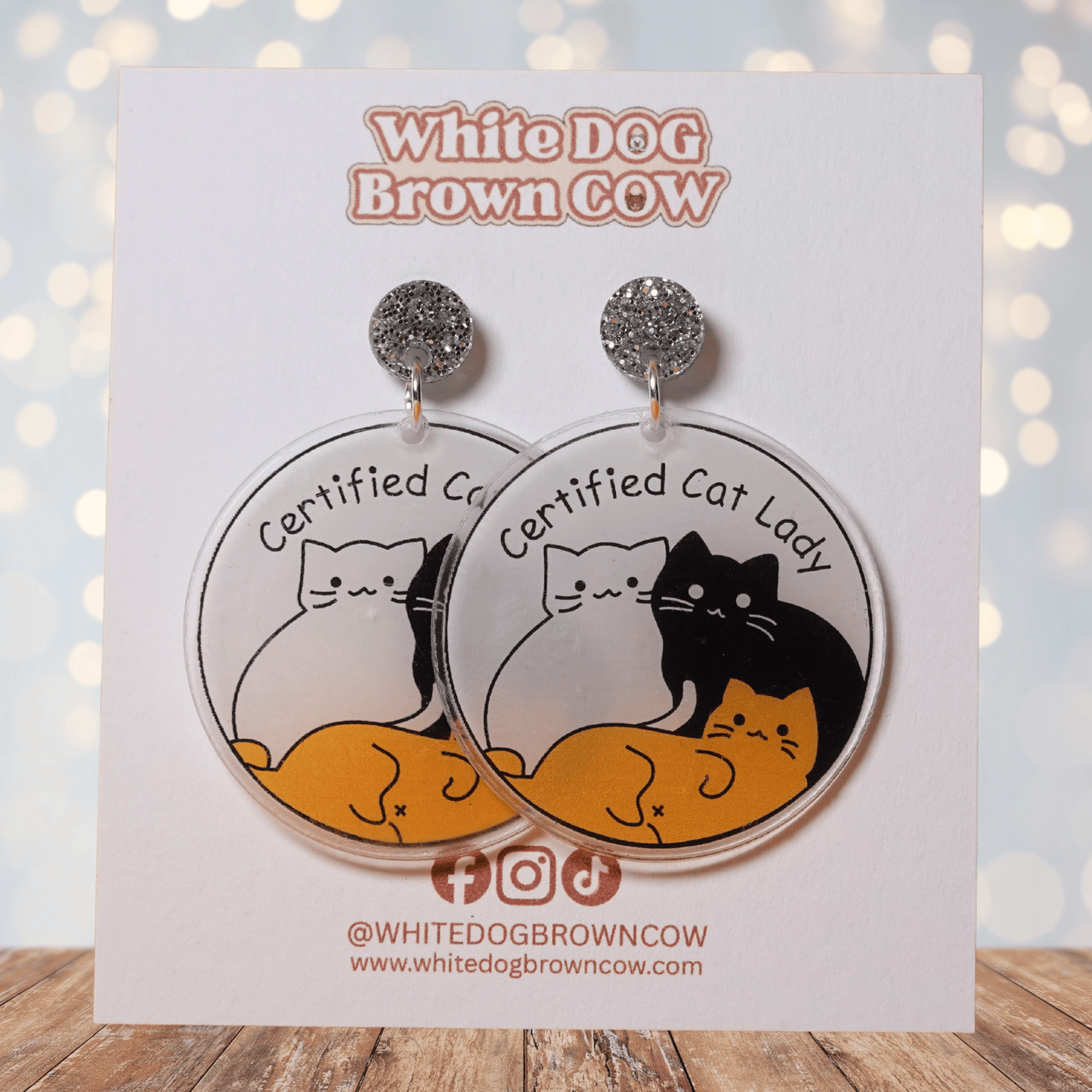 Round dangle earrings with cute cats and text “Certified Cat Lady”