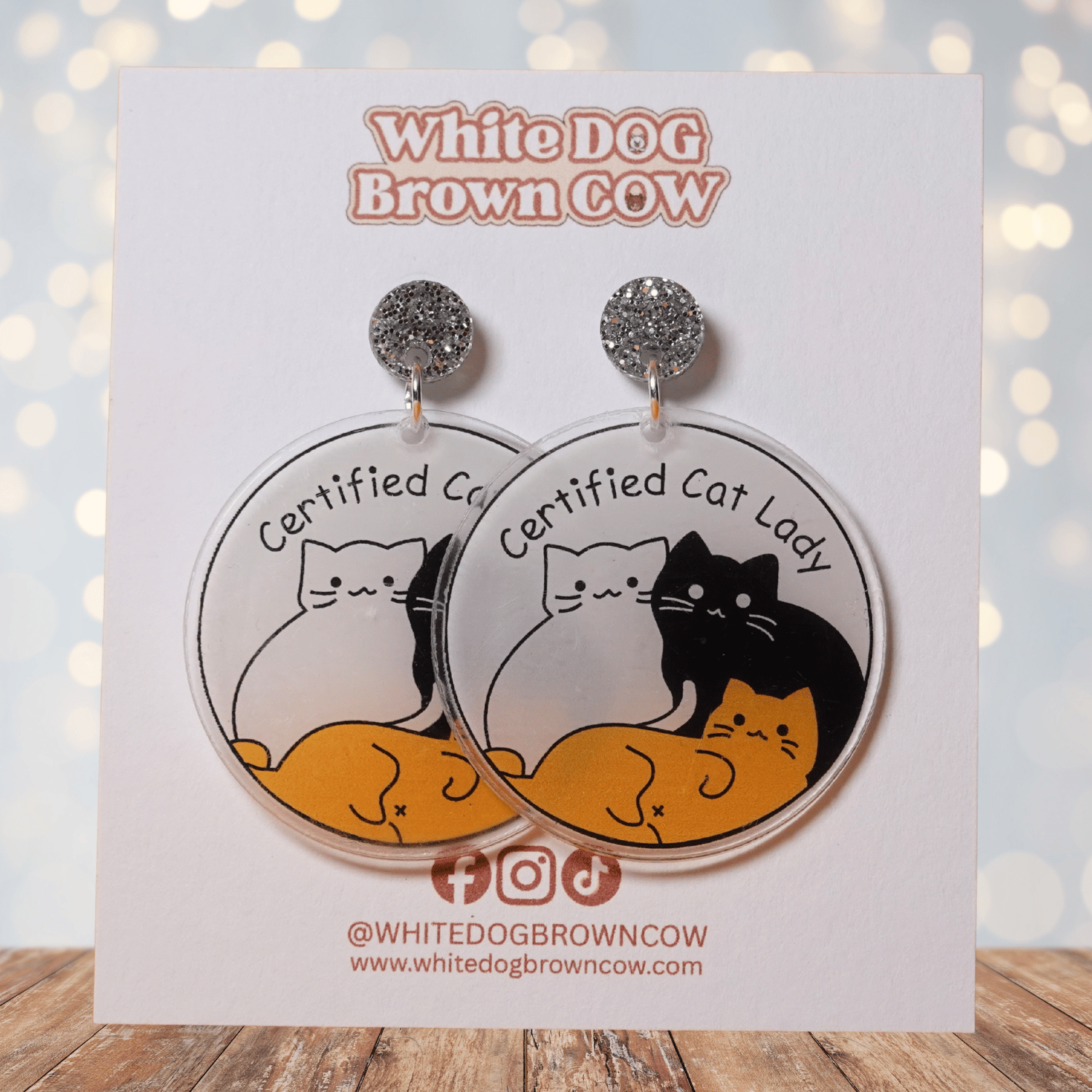 Round dangle earrings with cute cats and text “Certified Cat Lady”