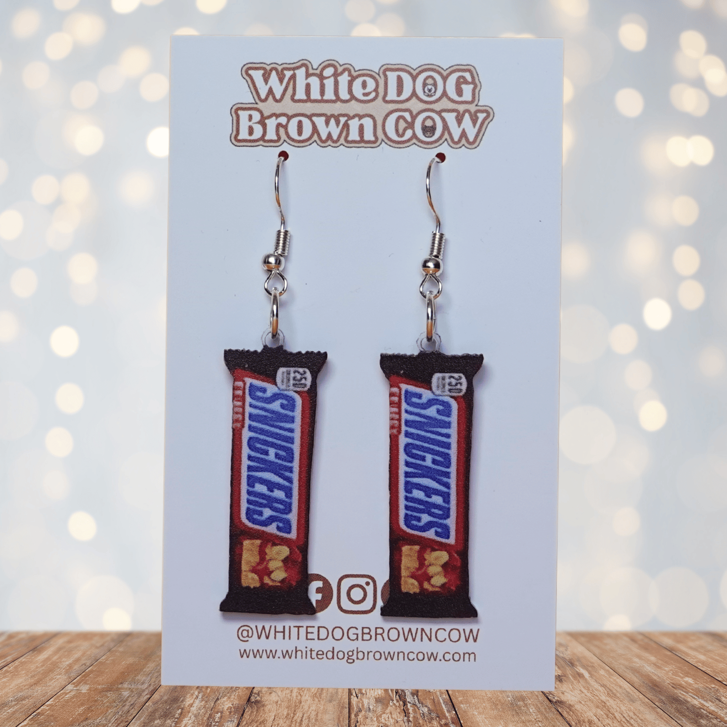 Chocolate bar shaped dangle earrings styled like a wrapped candy bar on silver hooks.