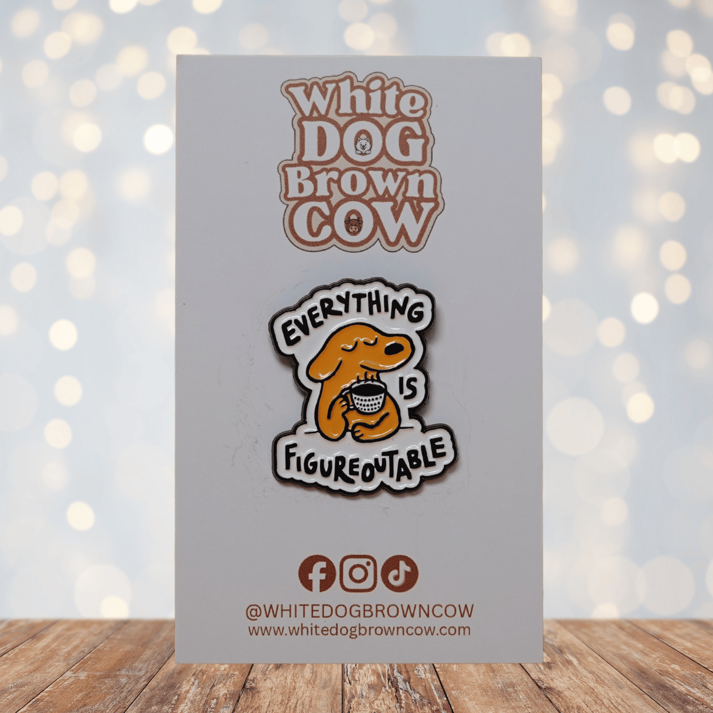 Cute enamel pin of a calm yellow dog holding a coffee cup with the phrase “Everything Is Figureoutable,” motivational coffee lover lapel pin.