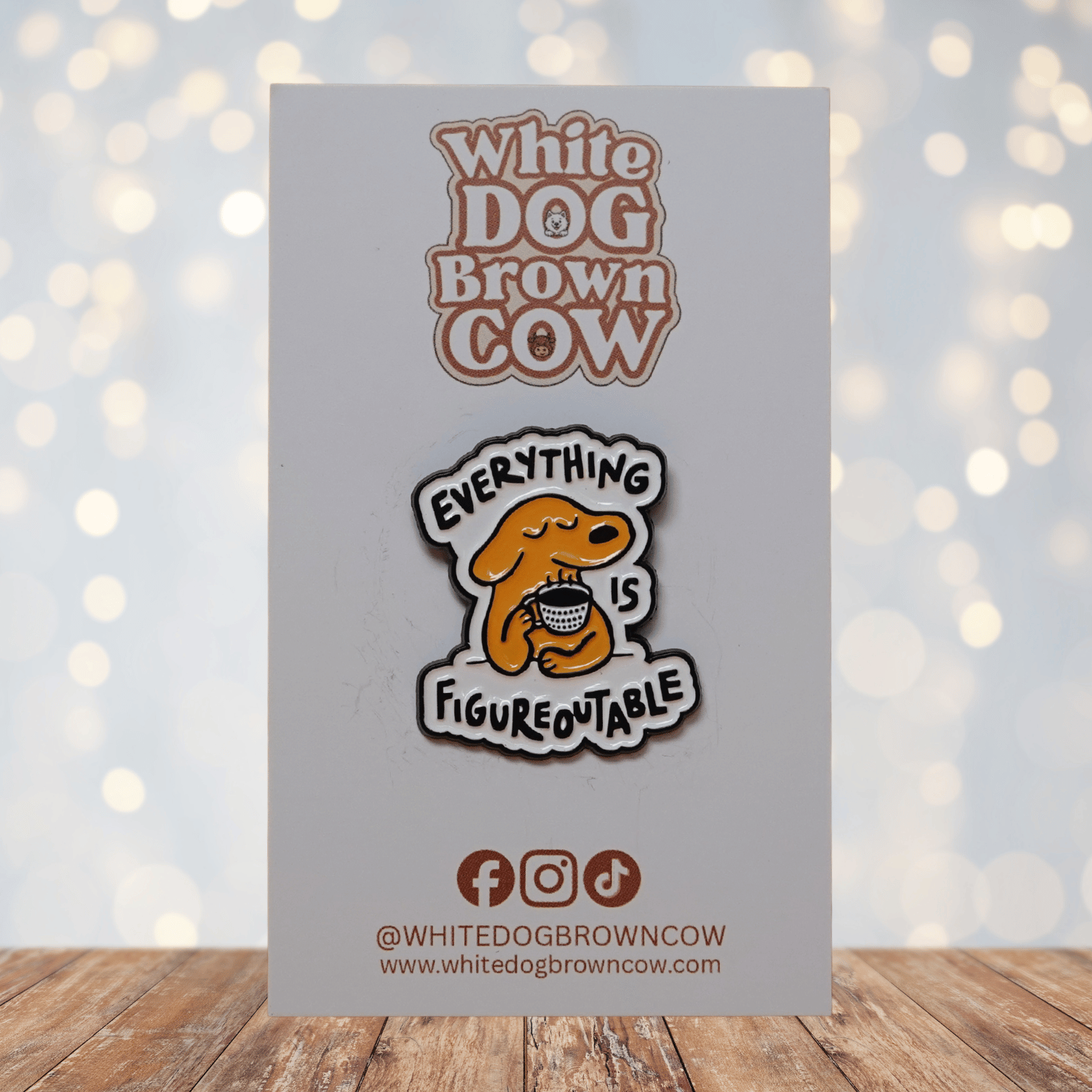 Cute enamel pin of a calm yellow dog holding a coffee cup with the phrase “Everything Is Figureoutable,” motivational coffee lover lapel pin.