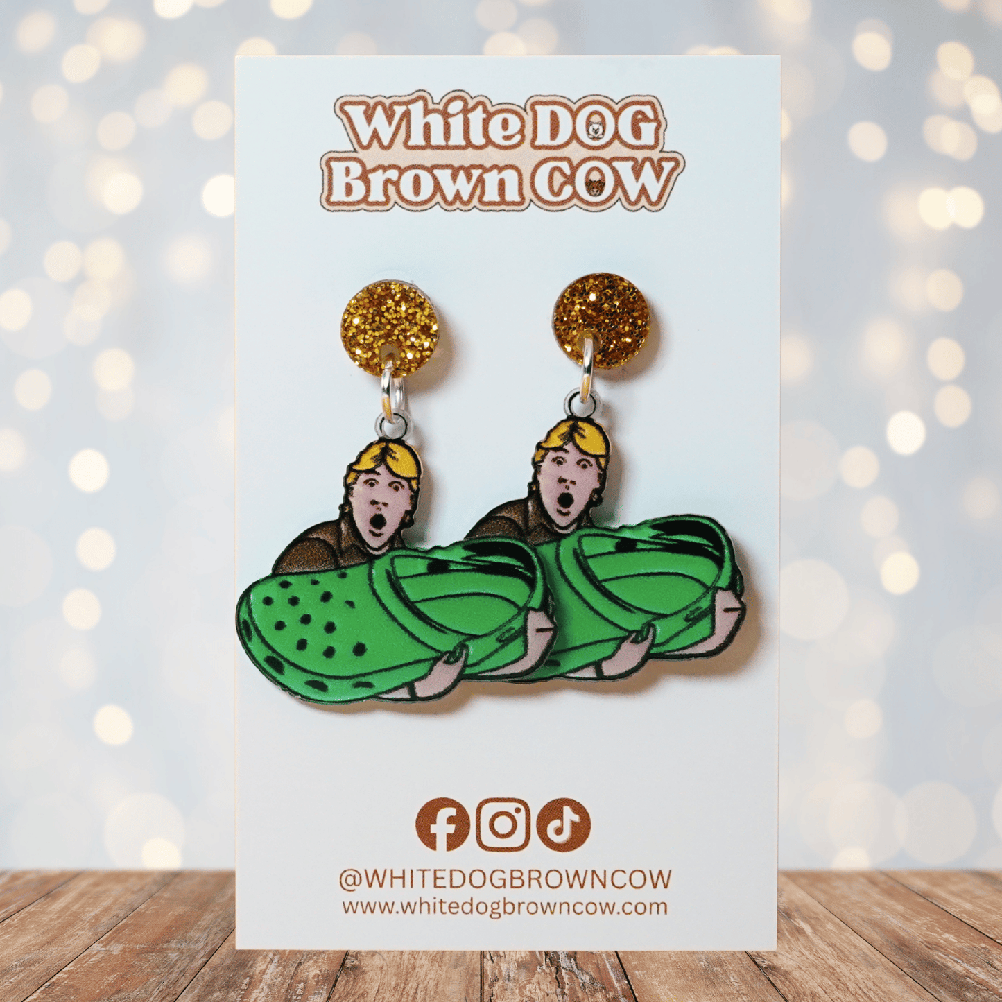 Novelty dangle earrings showing Steve Irwin holding an oversized green clog shoe
