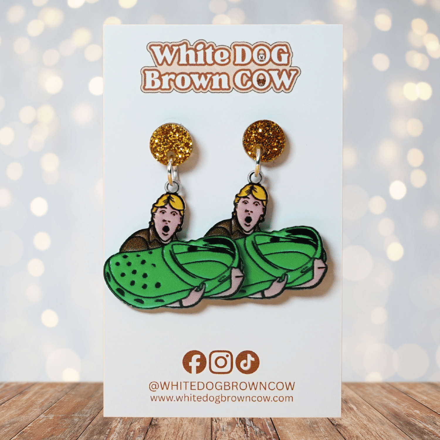 Novelty dangle earrings showing Steve Irwin holding an oversized green clog shoe