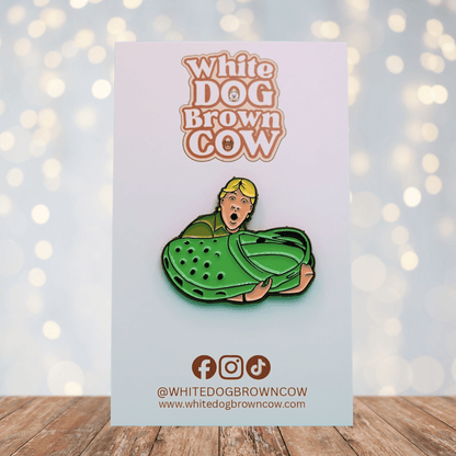 Funny enamel pin of Steve Irwin holding a giant green clog shoe, humorous novelty pin