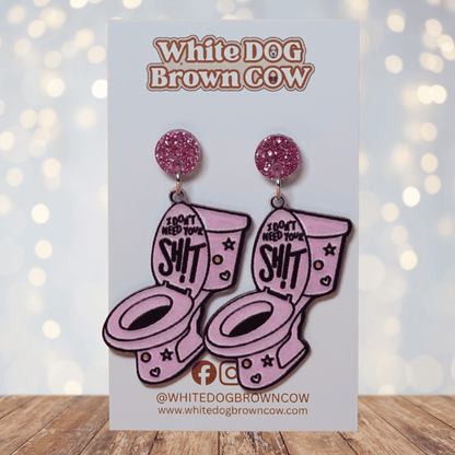 Pink novelty dangle earrings shaped like a toilet with text “I don’t need your sh*t”
