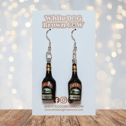 Mini Irish cream liqueur bottle shaped dangle earrings with dark bottle design and silver hooks.