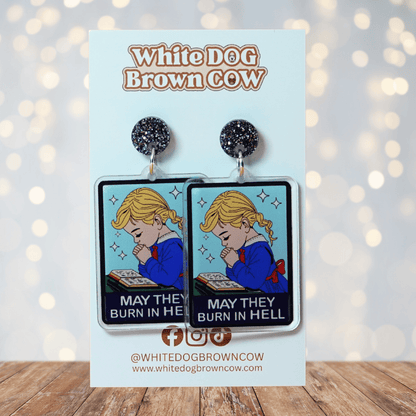 Clear acrylic dangle earrings with a vintage illustration of a praying girl and text reading “May they burn in hell”