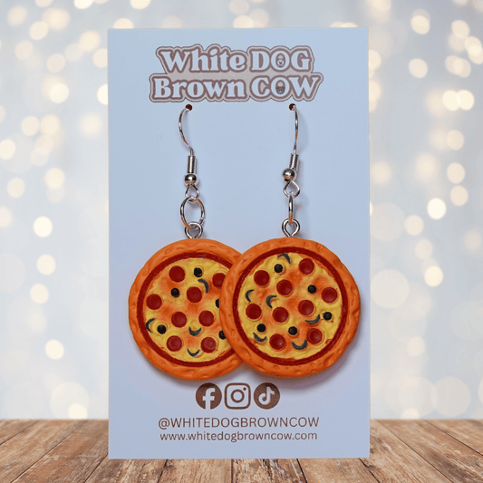 Cute dangle earrings shaped like whole pepperoni pizzas with colorful toppings on a round pizza design.