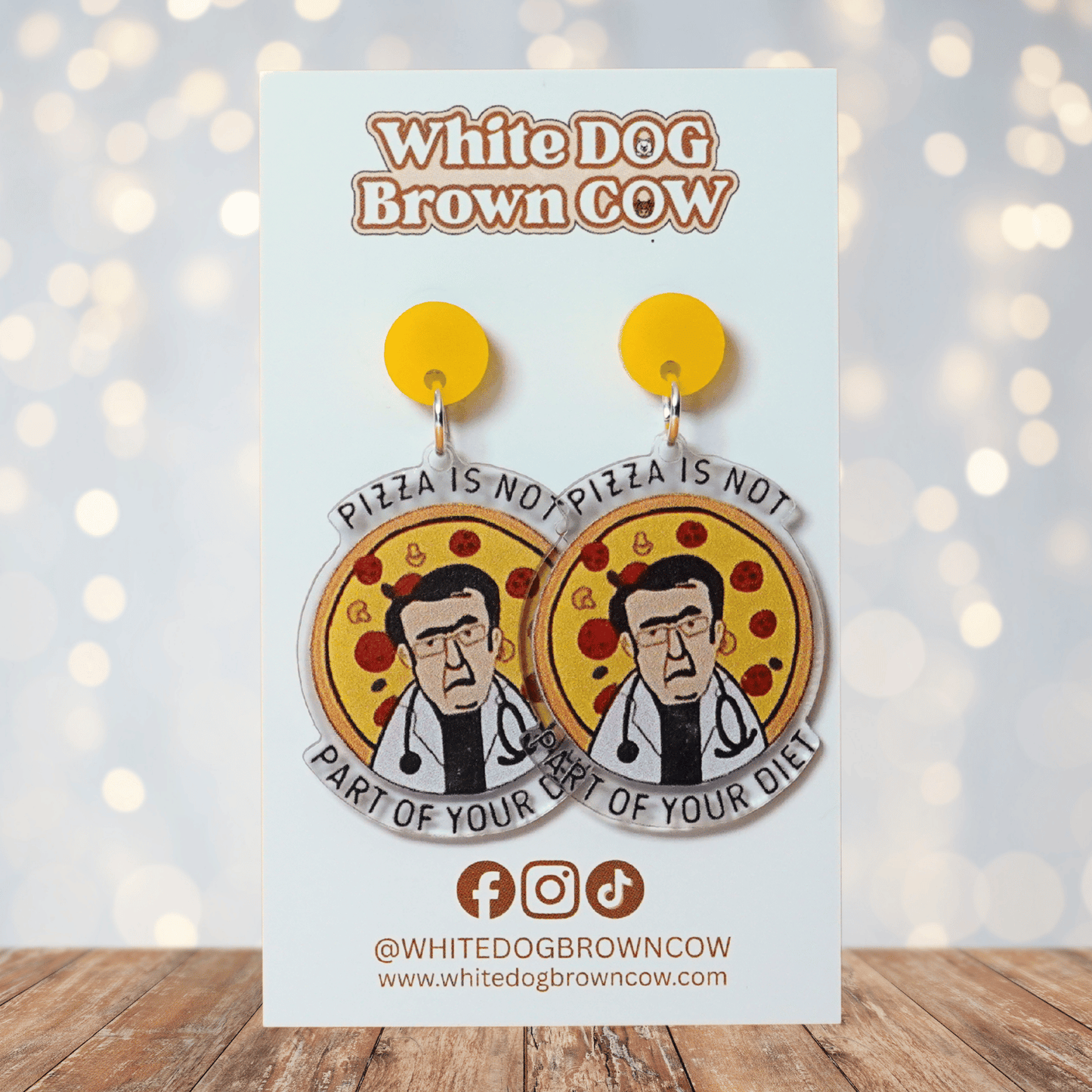 Funny acrylic dangle earrings showing Doctor Now from My 600lb Life in front of a pizza with the phrase “Pizza is not part of your diet.”