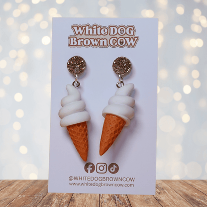 Cute dangle earrings shaped like soft serve vanilla ice cream in waffle cones.
