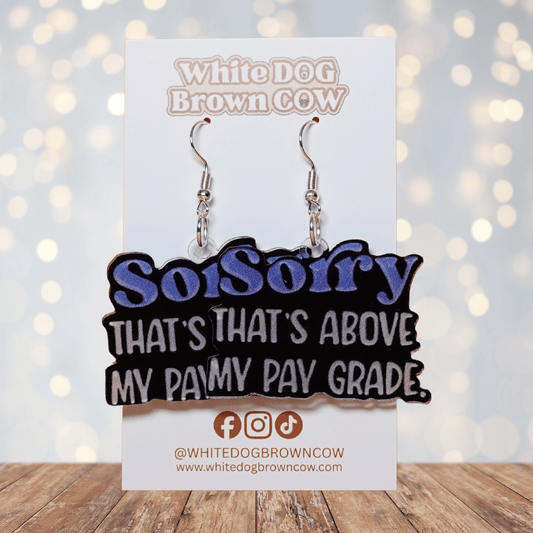 Black novelty dangle earrings with text “sorry that’s above my pay grade”