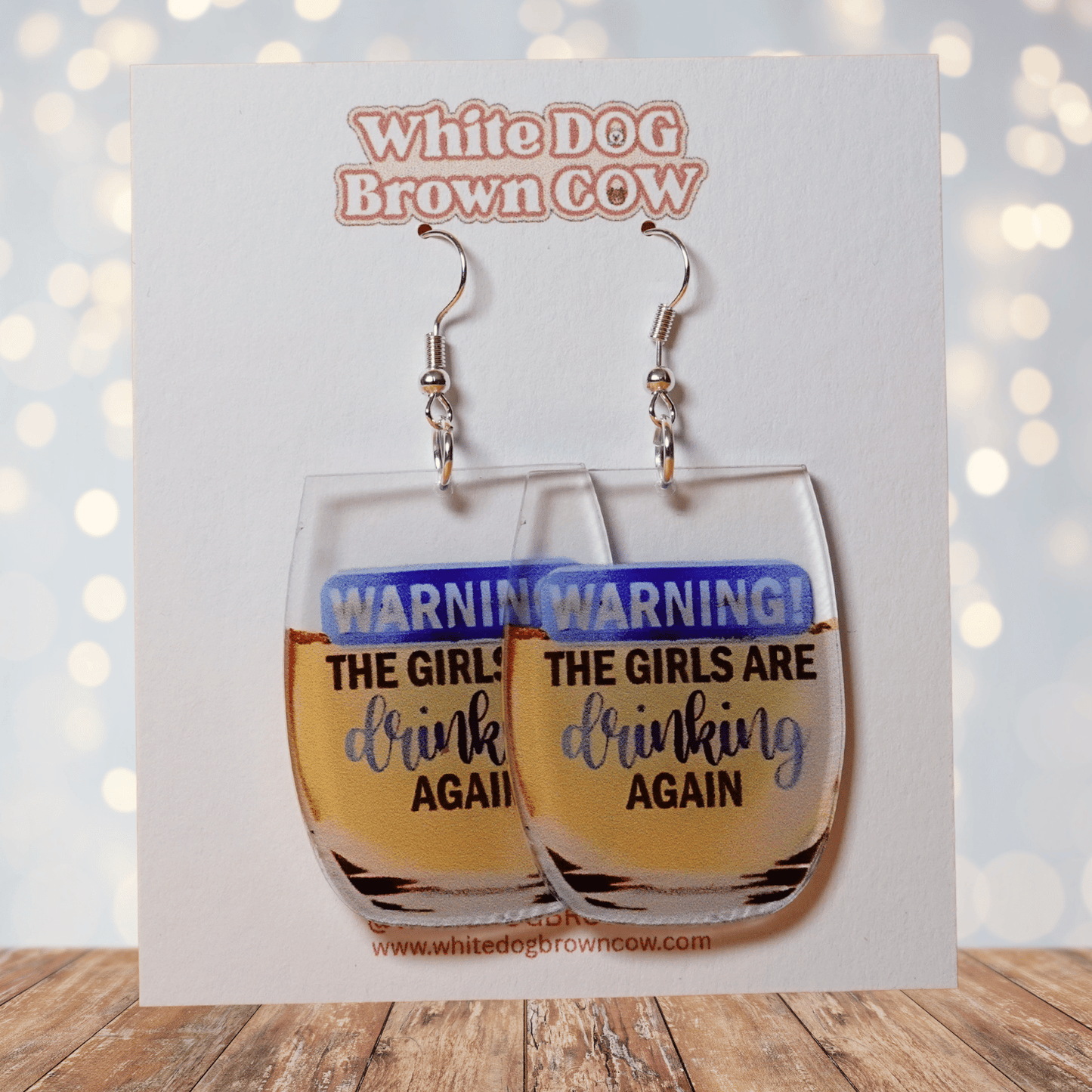 Wine glass dangle earrings with text “warning the girls are drinking again”