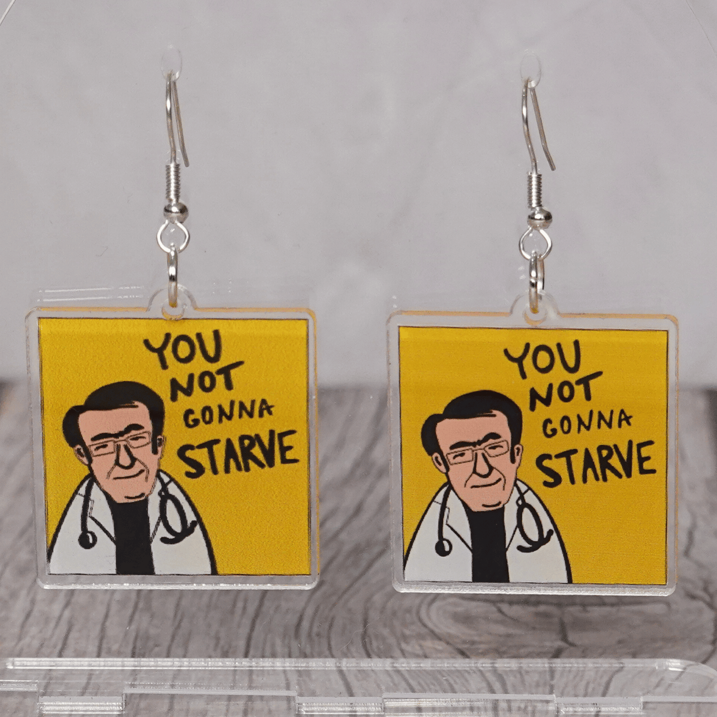 Square dangle earrings with Dr Now My 600lb Life and text “you not gonna starve”