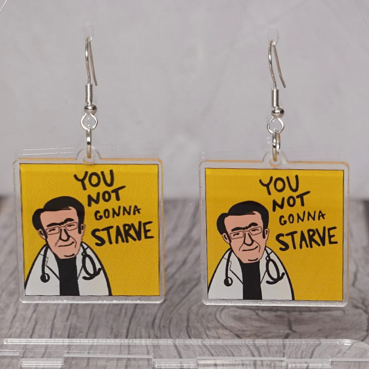 Square dangle earrings with Dr Now My 600lb Life and text “you not gonna starve”